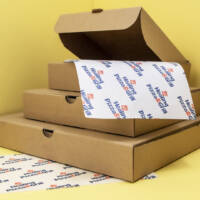 Healing Pizza & Grill branded greaseproof paper